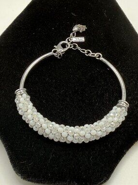 Silver bracelet with small white beads